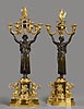 A magnificent pair of Empire gilt and patinated bronze and blue enamelled seven-light candelabra 